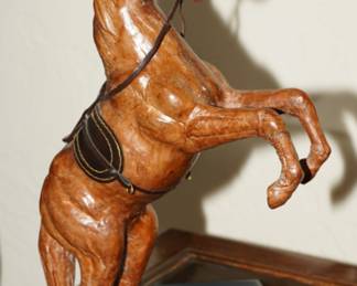 Leather wrapped bucking horse