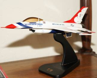 There are several di-cast, wood, and scale model cars and airplanes available for sale