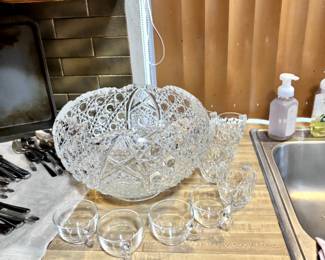 Cut glass punch bowl and cup
