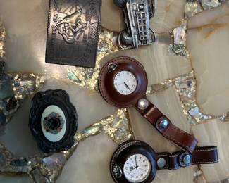 Belt buckles $7.00 and watches $15.00