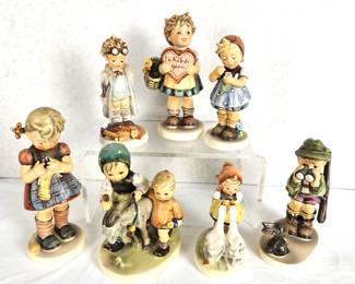 Lot DH #113 - Lot of Seven Assorted Goebel Hummel Figurines - Some Older and Rarer - "Good Hunting", "Homeward Bound", "Goose Girl", "A Stitch in Time", "Doctor", "Valentine Gift" & "Daisies Don't Tell".  No Boxes 