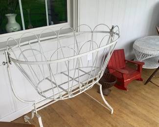 Cast iron cradle.  What a planter or firewood storage.