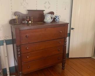 Very nice cherry graduated chest of drawers.  In original surface.