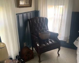 Nice newer leather wing back chair.