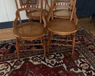 Very nice set of four caned chairs  with interesting workmanship.