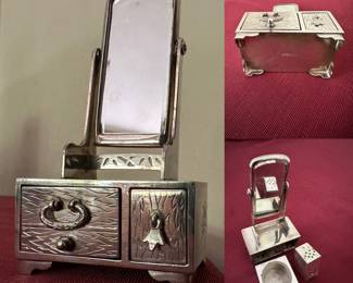 Sterling silver, salt cellar and pepper shaker in the form of a miniature dressing table with mirror