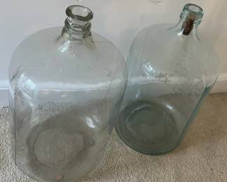 Vintage 5-gallon glass bottles.