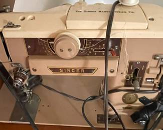 Singer Sewing Machine with accessories.