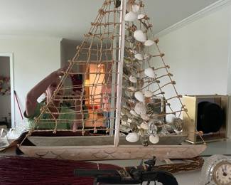 Boat with rope and seashell mast.