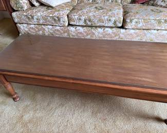 (Lot 14) $150 -  Vintage Pembroke Coffee Table with 2 drawers, glass protective top cover.   56” x 21d x 16h.  Coordinating pair of end tables also anvailable