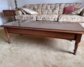 (Lot 14) $150 -  Vintage Pembroke Coffee Table with 2 drawers, glass protective top cover.   56” x 21d x 16h.  Coordinating pair of end tables also available.   