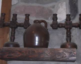 jug and wooden candle holders