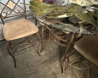 Glass bar height table and wrought iron chairs