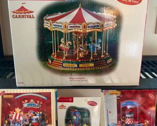 Dept 56 Carnival The Red Ruby Carousel in Box 
Dept 56 Carnival Flying High Space Planes
Lemax Signature Collection Junior Flight School in Box