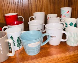 Variety of Starbucks coffee mugs