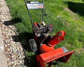 Ariens two-stage snowblower with electric start and chains.