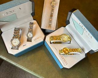 Geneva his and hers watch sets, and the ladies quartz watch in the middle.
