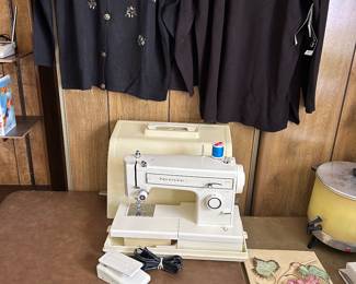 Kenmore Sewing Machine, above - a couple of ladies tops with tickets still attached, lower right is a Fruit/Flowers chalkware plaque