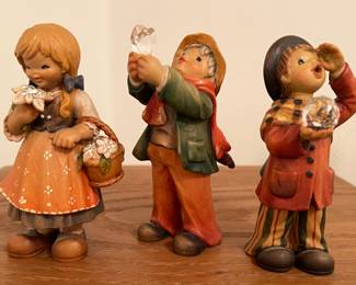 Anri wood figurines holding crystals