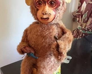 1930's wind-up monkey with tin face and drum