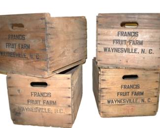 several vintage wooden advertising crates