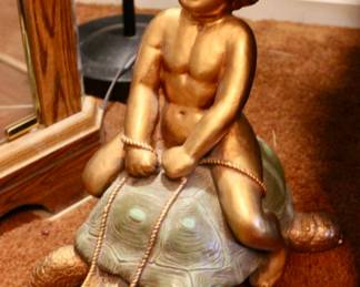 Vintage Gold leaf boy riding turtle