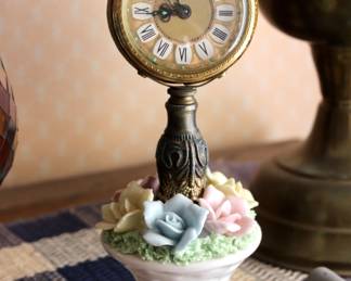 Lots of vintage and antique wood and ceramic clocks