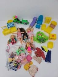 An Assortment of Vintage Dolls, Clothes & Furniture