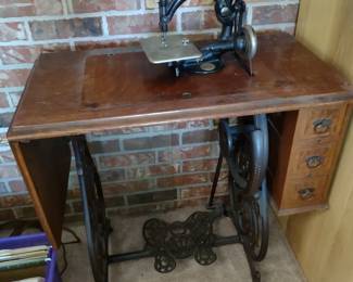 Wilcox and Gibbs antique seeing machine in cabinet