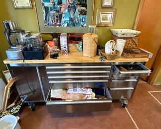 More kitchen stuff. The steel cabinets underneath with many flat drawers was a great storage place. A guy may want to put this in his garage, but it is polished stainless with a wood top. The picture above is a Mary Ann Hickey original