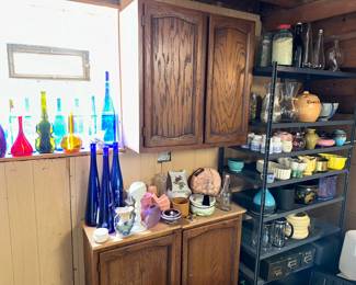 A colorful collection of pots, vases, bottles