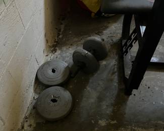 Dumbbell and concrete weights.