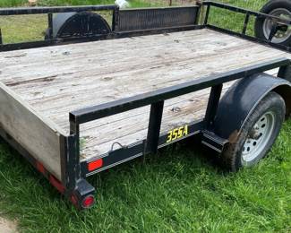 12 FOOT TRAILER WITH DUAL FRONT SIDE LOADING AND RAMPS.