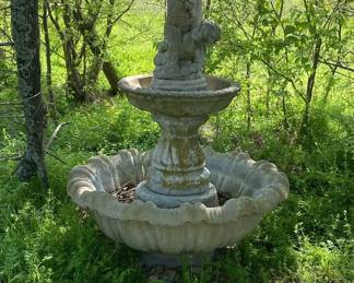 THIS IS A VERY LARGE CONCRETE FOUNTAIN.