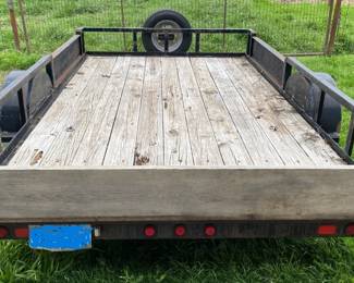 12 FOOT TRAILER WITH DUAL FRONT SIDE LOADING AND RAMPS.