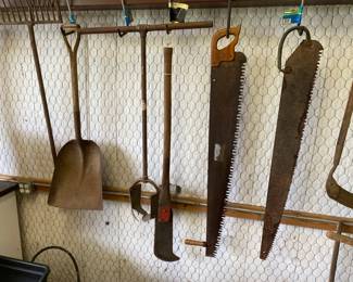 A NICE SELECTION OF ANTIQUE SAWS AND TOOLS.