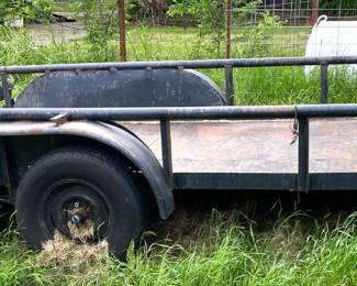 16' DUAL AXLE TRAILER WITH STEEL FLOOR.