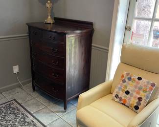 Antique dresser, electric recliner, and rug