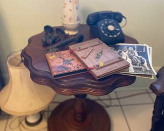 Antique table, vintage photo, albums, and antique phone