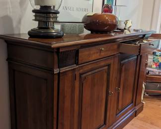 What makes a buffet a buffet? It sits close to the floor. This cabinet waste. No space. Establishes the room provides all the storage on these for China and silver and a beautiful surface for display or serving.