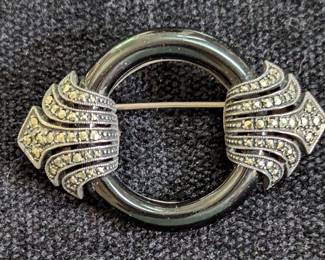 This onyx and marcasite brooch pendant is an excellent example of art deco elegance. 