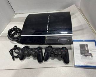 PlayStation 3 with 2 controllers and charging and power cord and PS3 play beyond in package