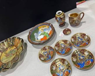Satsuma bowl, hand painted plates and creamer cup, and a decorative plate