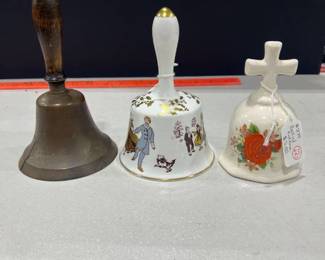 The Hammersley annual bell, brass bell and a bell with red rose
