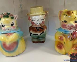 AMERICAN BISQUE Blushing Pig Cookie Jar, RRPCO Sheriff Pig Cookie Jar, and AMERICAN BISQUE Pig in Scarf Cookie Jar