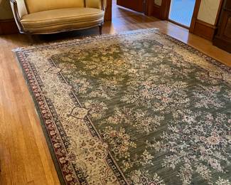 green and beige wool area rug, antique settee with newer upholstery