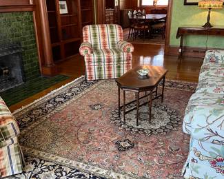 crewel upholstery sofa, striped chairs, antique coffee table and large beautiful area rug