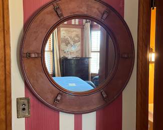 porthole style leather clad mirror