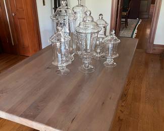 cerused wood trestle table and glass apothecary jars