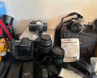 Olympus E-1, Canon AE-1 Program, and Minolta Maxxum GT Digital and 35mm Film Cameras